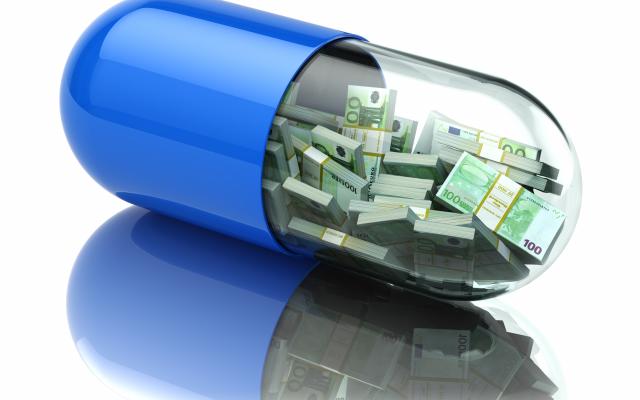 Een capsule (pil) met geldbiljetten.