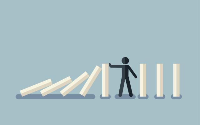 Illustratie van een mannetje dat omvallende blokken tegenhoudt
