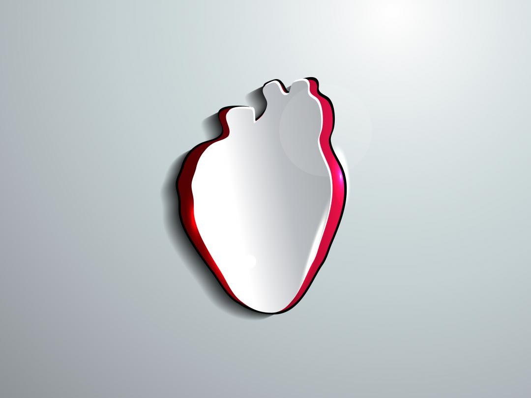 Hart uit papier uitgesneden met rode achtergrond