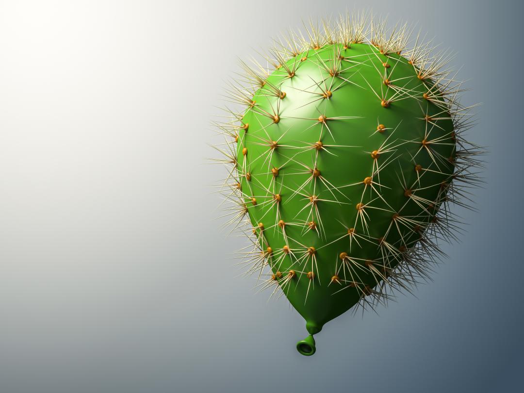 Een groene ballon met de stekels van een cactus.