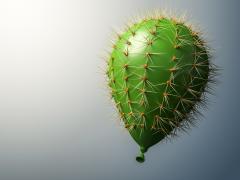 Een groene ballon met de stekels van een cactus.